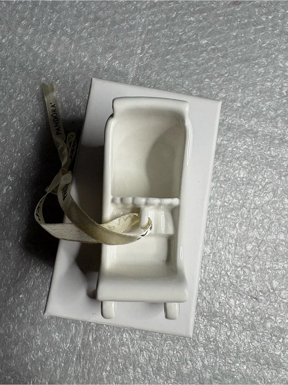 Pandora white porcelain sleigh ornament